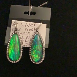 Sterling silver ear hook, resin earrings.They are 2”long. Price 15.00